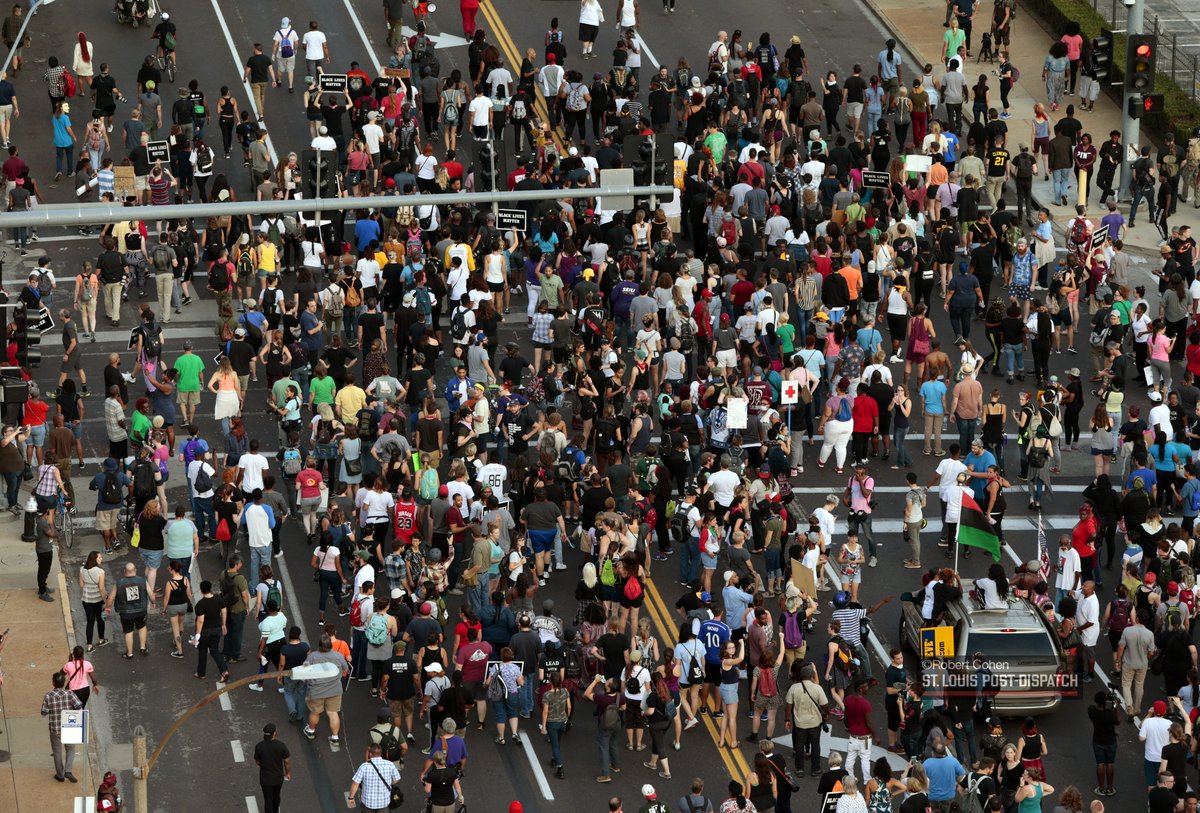 Elevated views of marchers headed toward @SLMPD headquarters. #STLVerdict   
