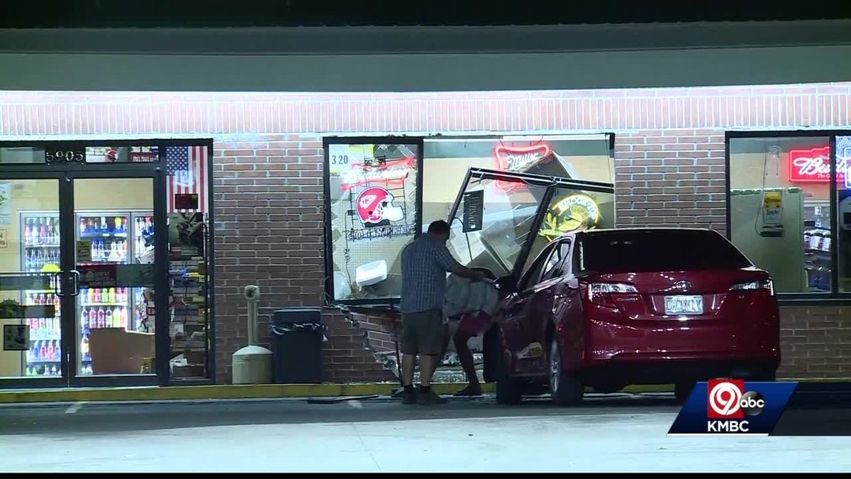 A car crashed into a convenience store near Interstate 29 and Northwest 72nd Street about 2 a.m. Thursday. Police said the driver was trying to take his shoes off with the car in gear.