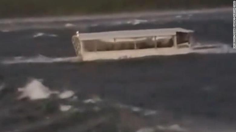 Passenger in a nearby vessel shows a duck boat struggling through white-capped waters on Table Rock Lake in Branson just before it capsized and sank.