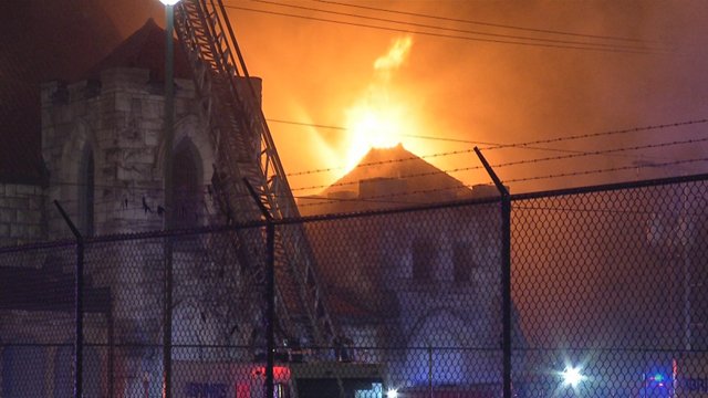 Flames tore through a historic church in east Kansas City late Sunday night and have caused parts of the building's roof to collapse.
