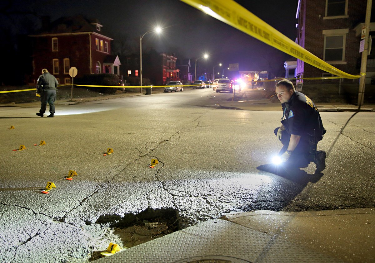 Police investigate the scene of a shooting in the 1400 block of Arlington Ave in St. Louis. According to police a woman in an SUV was shot and transported to the hospital. No word on her condition. Rifle bullet casings littered the scene.   