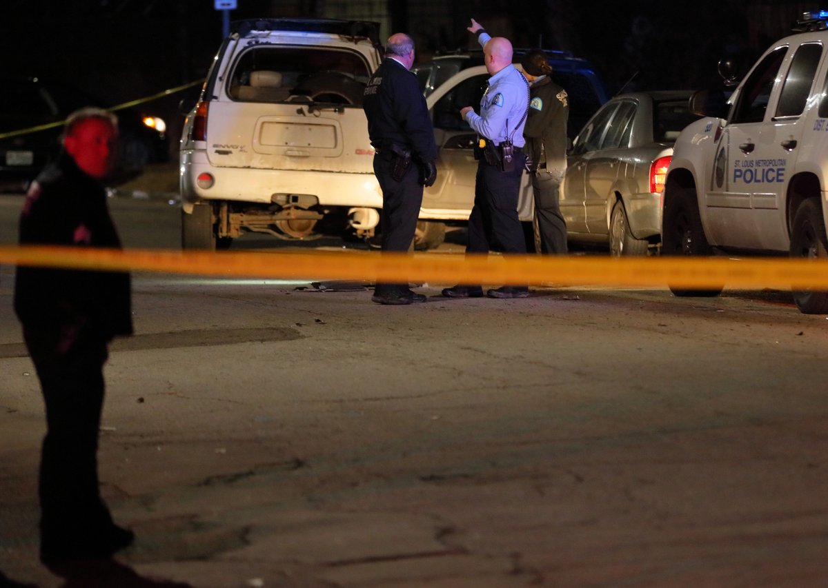 Police investigate the scene of a shooting in the 1400 block of Arlington Ave in St. Louis. According to police a woman in an SUV was shot and transported to the hospital. No word on her condition. Rifle bullet casings littered the scene.   
