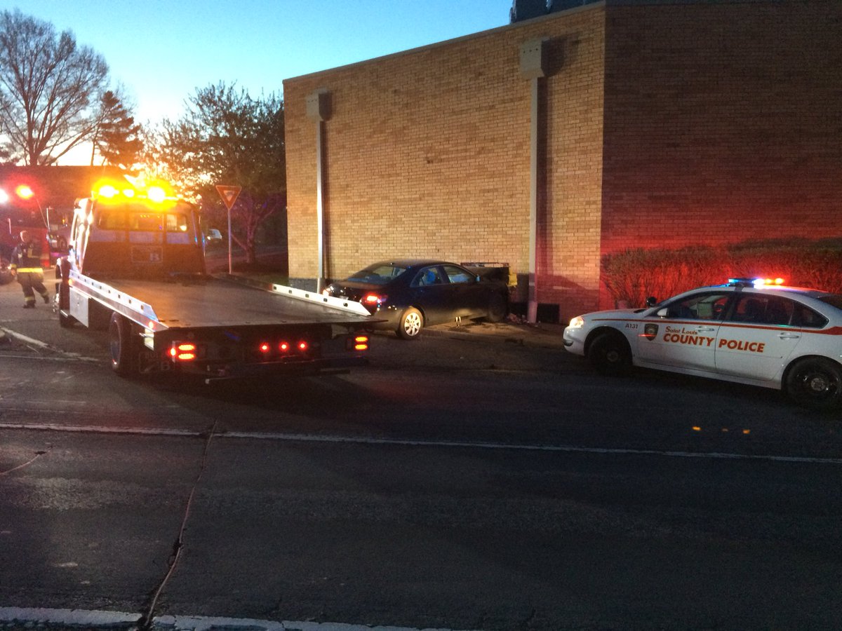 Tow truck on the scene in North County where a driver crashed a car into the back wall of the Schnucks on Bellefontaine just north of I-270. Two of three northbound lanes of Bellefontaine blocked