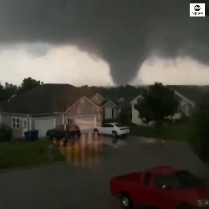 Residents capture footage of tornado swirling above houses in Carl Junction, Missouri, as severe weather hits the region.    