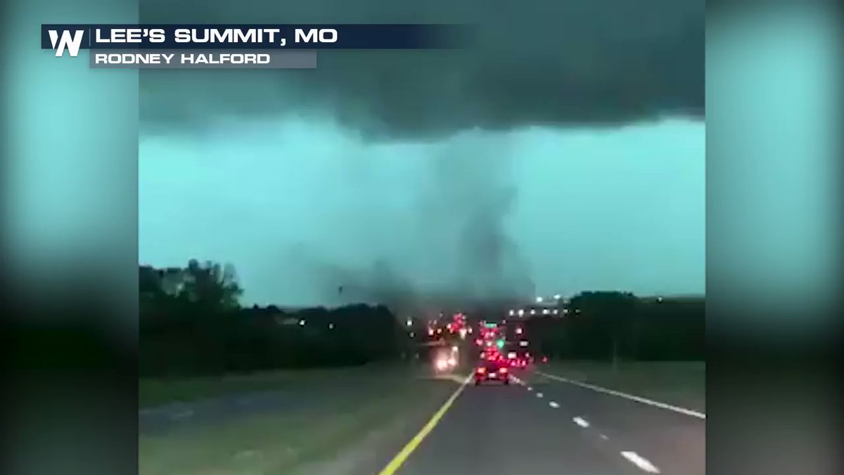 A possible land spout tornado was filmed moving across Highway 150 close to Lee's Summit, Missouri, on Friday, as thunderstorms rolled through the Kansas City area