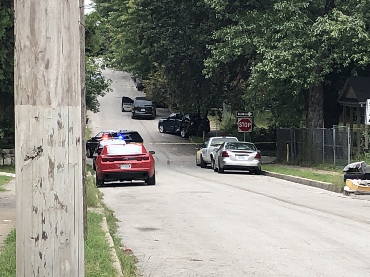 Kcpolice working a big scene near Independence and Indiana.  Chief Rick Smith says officers discharged a weapon.  Smith says preliminary info shows no officers injured. A police SUV looks T-Boned, here, as well. A minivan is also on street with door open.