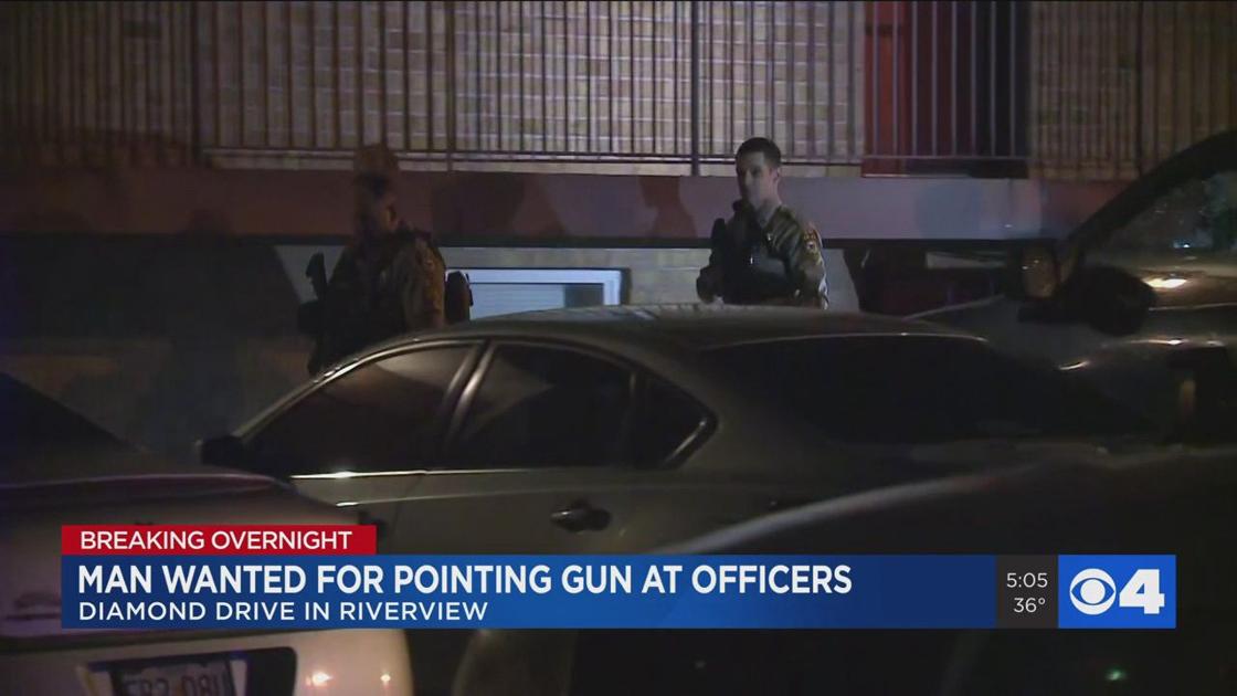 An overnight standoff at a North City apartments has ended after a man pointed a gun at officers.