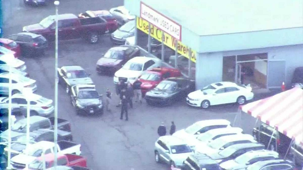 The Clay County Sheriff's Department said the suspect in a shooting at an Independence car dealership and an armed robbery at a Liberty sporting goods store has died after an officer-involved shooting.