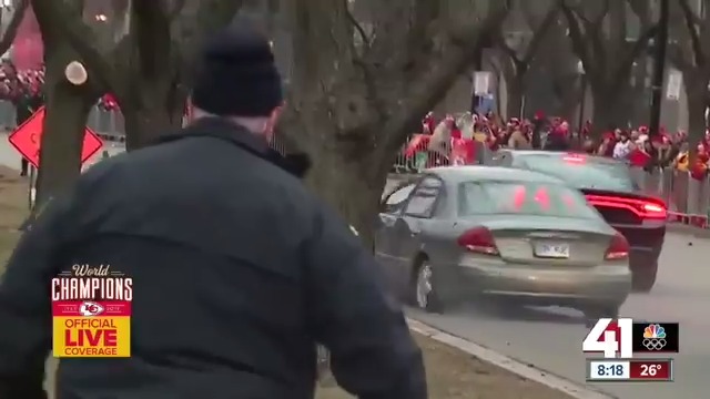 A car broke through the barriers of the parade and was pursued down the route by police.