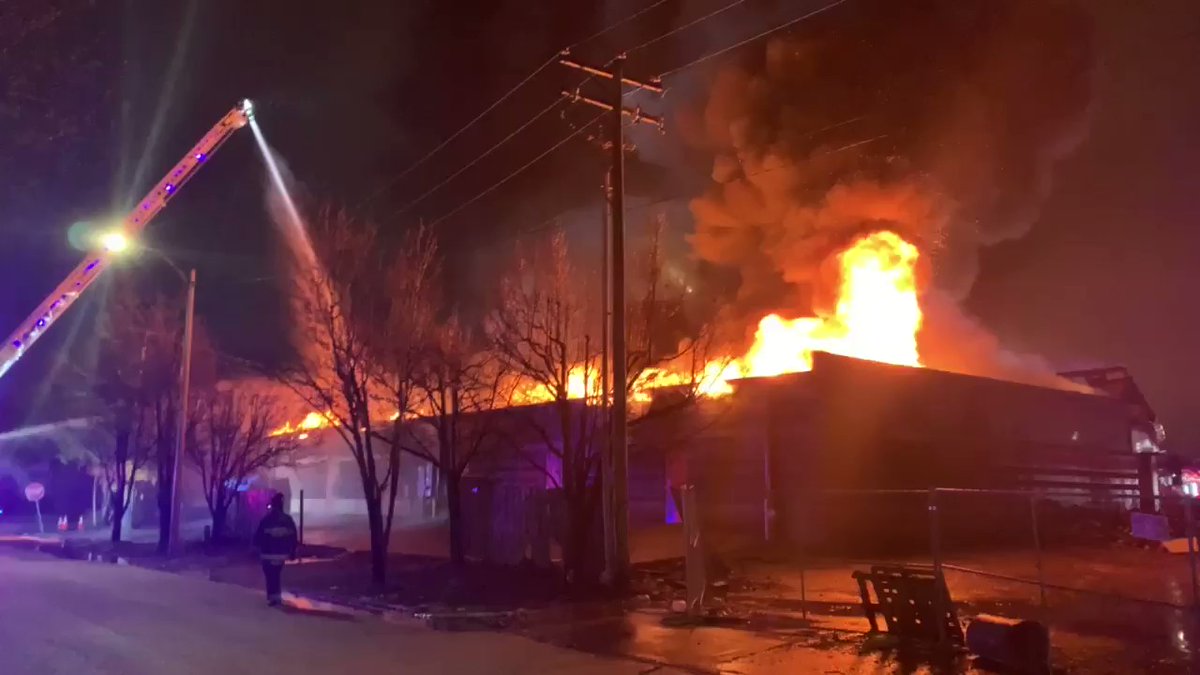 Battalion 6 requesting a 2nd Alarm; 60 firefighters operating on scene. Four master streams deployed. Full defensive operations ongoing.