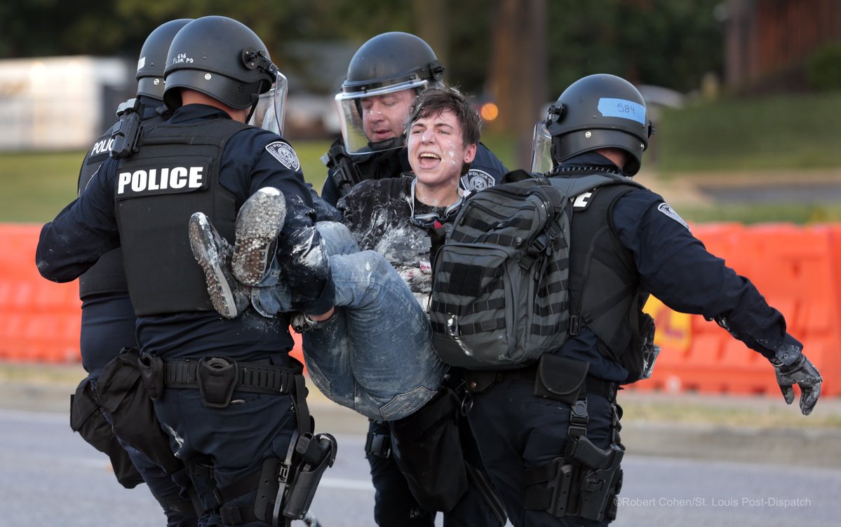 Two arrests made at Florissant Protest after people stopped for trying to re-paint BlackLivesMatter on the street. Officers confiscated rollers and paint buckets