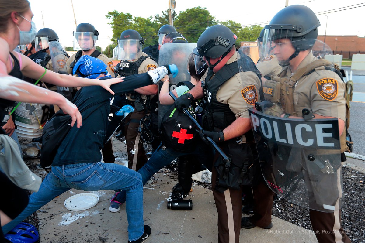 Two arrests made at Florissant Protest after people stopped for trying to re-paint BlackLivesMatter on the street. Officers confiscated rollers and paint buckets