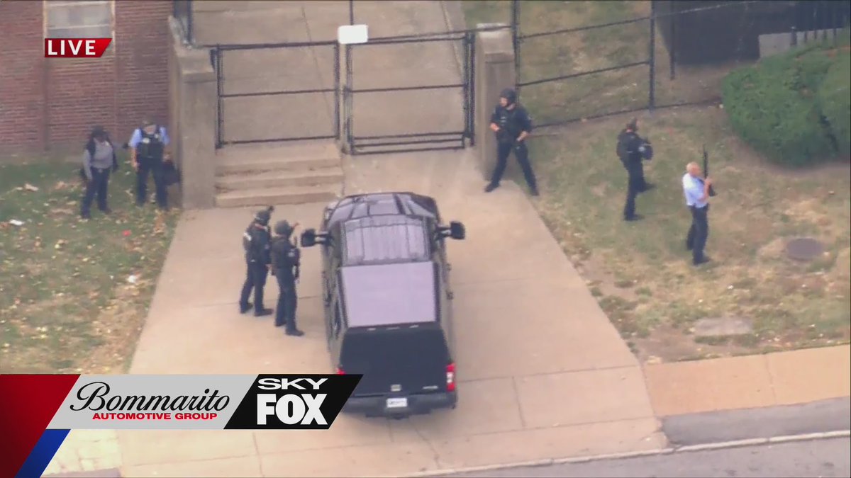 Massive police presence at Cleveland School at the intersection of Arsenal and Kingshighway in St. Louis.  Three people injured