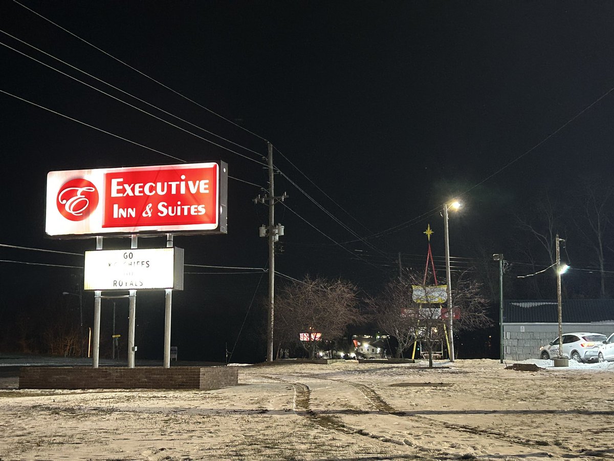 Active scene at Executive Inn&Suites. According to police: officers did a routine patrol-saw a suspicious car. An officer stepped out of patrol car, a person got out of the car with a handgun. Officer fired a shot - that person is now in the hospital with  life threatening injuries