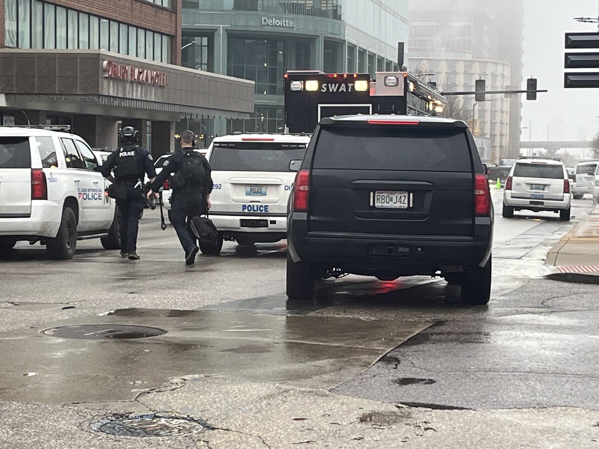 Heavy police presence at Drury Plaza Hotel at 4th and Market in downtown St. Louis. St. Louis Police confirm an armed man is in a hotel room holding a woman and children with him. The SWAT team is here along with many other law officers. No word on any injuries